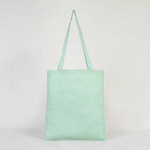 Mint green tote bag on a light gray background