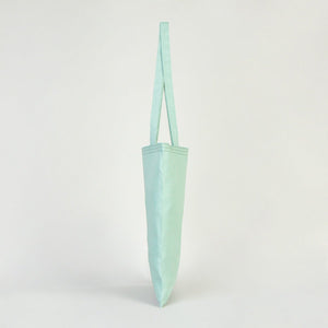 Light blue tote bag on a white background