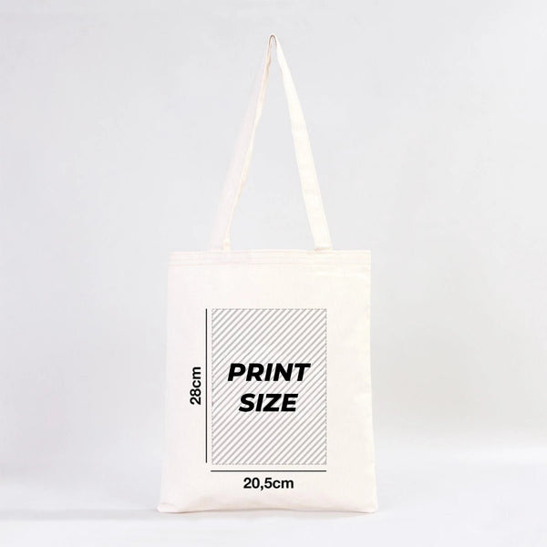 Tote bag blanc avec détails des dimensions de l'impression sur fond gris clair pour Pamusan.