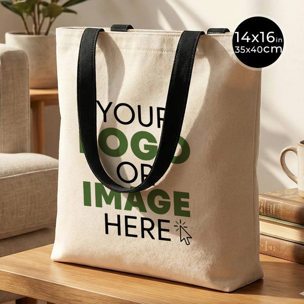 Tote bag beige à anses noires posé sur une surface en bois, avec l'inscription Your logo or image here personnalisable pour Pamusan.