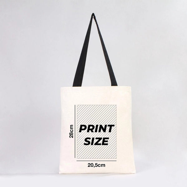 Tote bag avec informations sur les dimensions de l'impression sur fond gris clair chez Pamusan.