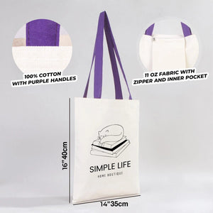 Tote bag blanc à anses violettes arborant la marque Simple Life Home Boutique, présenté sur un fond gris clair.