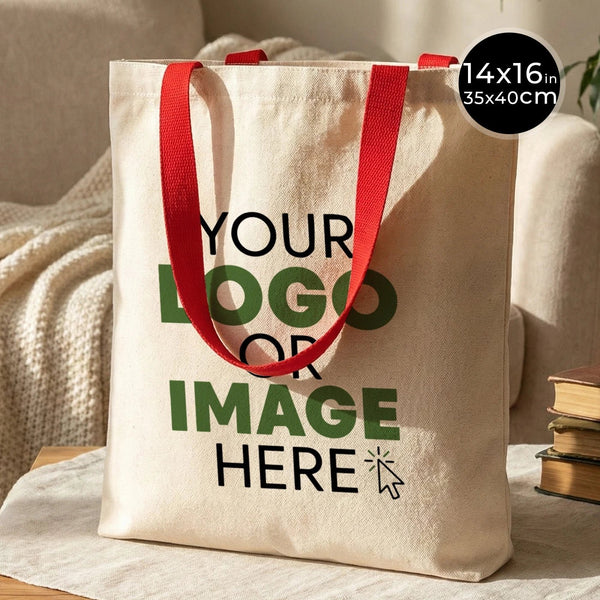Tote bag beige à anses rouges sur fond neutre, idéal pour un EVJF chez Pamusan.