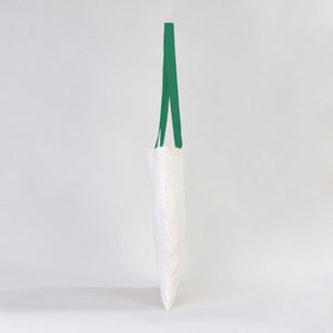 White vase with a green ribbon on a white background