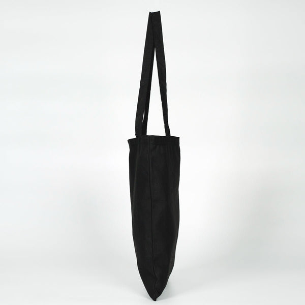 Black tote bag with a long strap on a white background